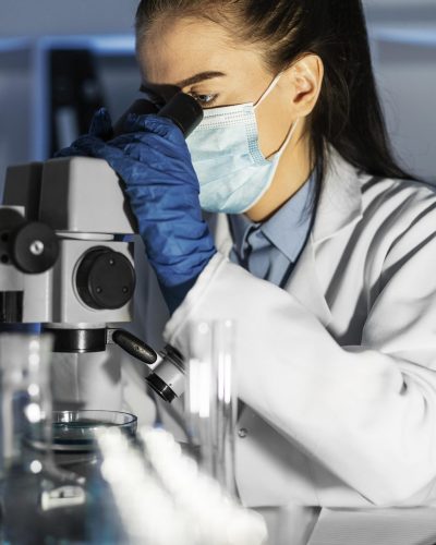 close-up-woman-working-with-microscope