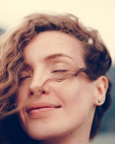 portrait-of-a-beautiful-woman-with-curly-hair-PLZA4CG (1)
