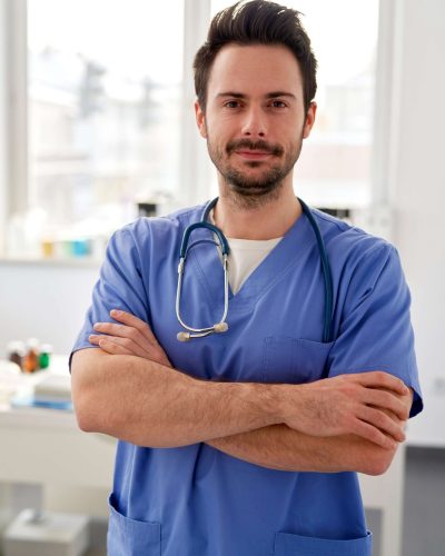portrait-of-young-smiling-doctor-in-the-doctors-of-GB3RUNL (1)